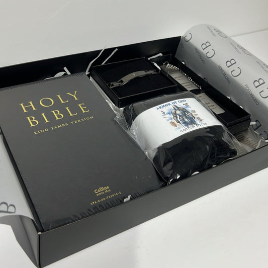 Bible set with black cover and white pages in a box on a light gray background