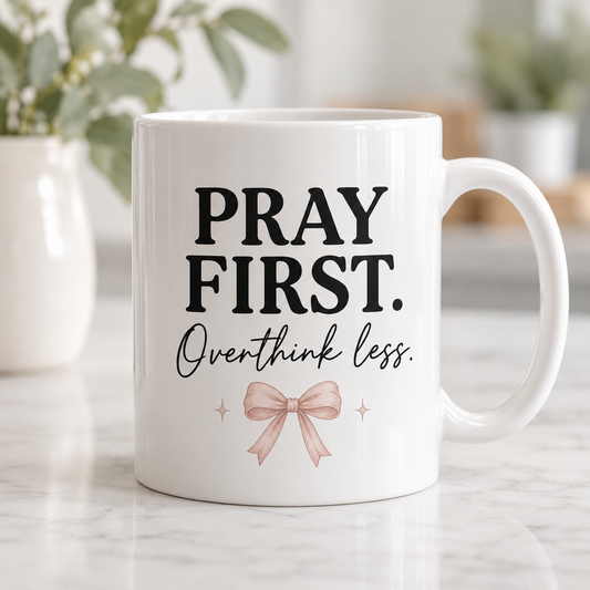 Pray first mug