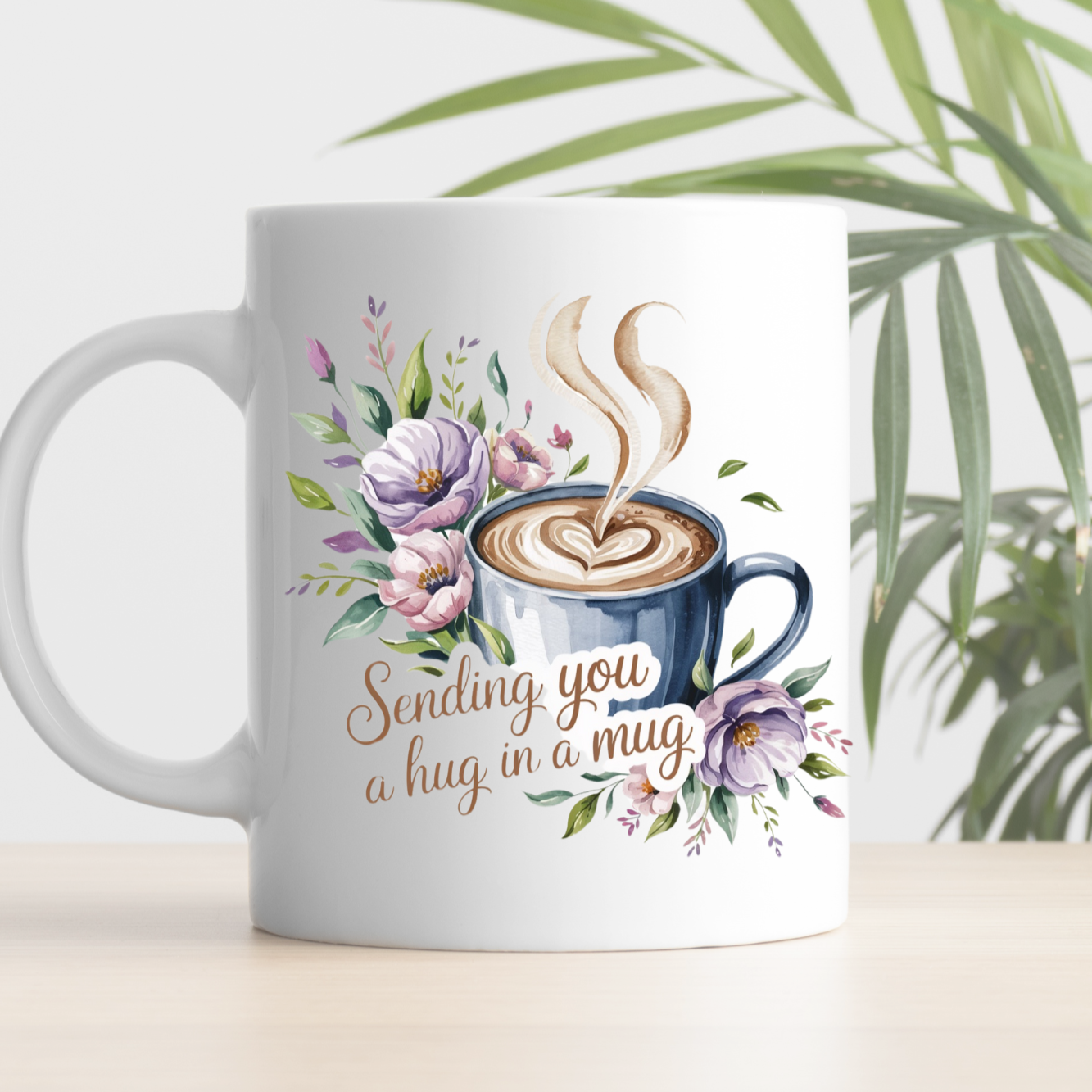 Mug with coffee design and text 'Sending you a hug in a mug' on a white background